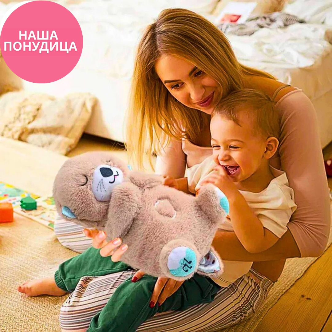 Meda koji spava diše svetli i svira uspavanke